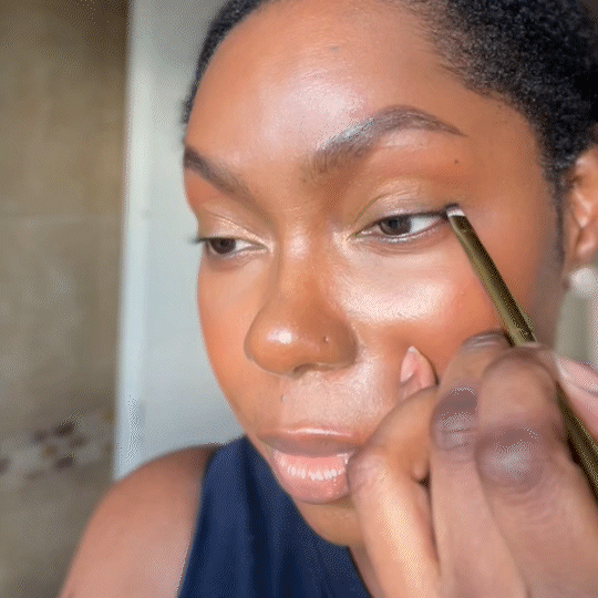 Model using Adeline Tyler Brush No. 04 – Vegan Angled Eyeliner Brush for winged liner and precise eye definition